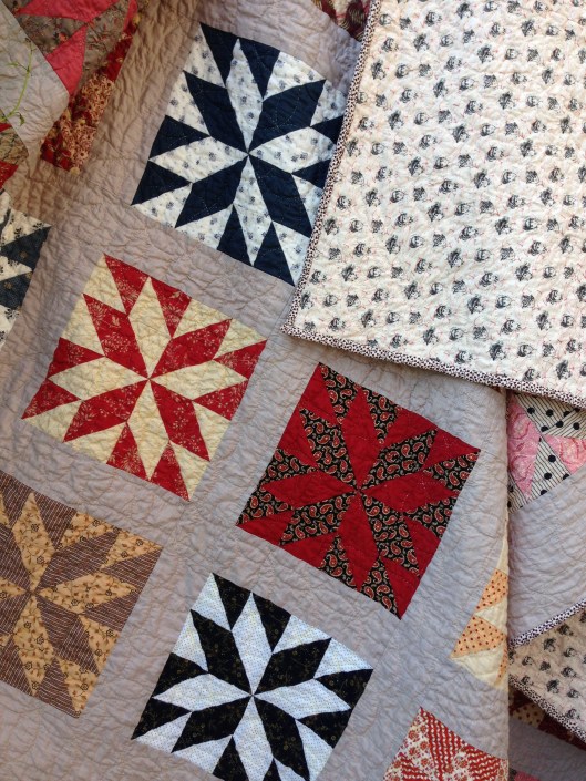 Finished quilt showing reproduction backing fabric